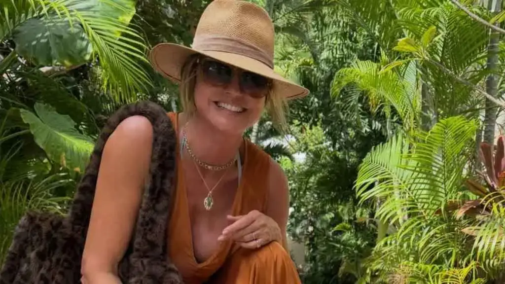 Heidi Klum Stuns in Plunging Orange Dress During Tropical Getaway