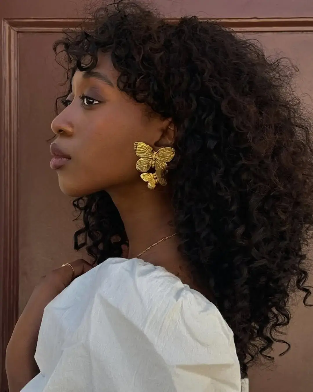 The Butterfly Cut for Curly Hair Takes Flight as a Summer Sensation