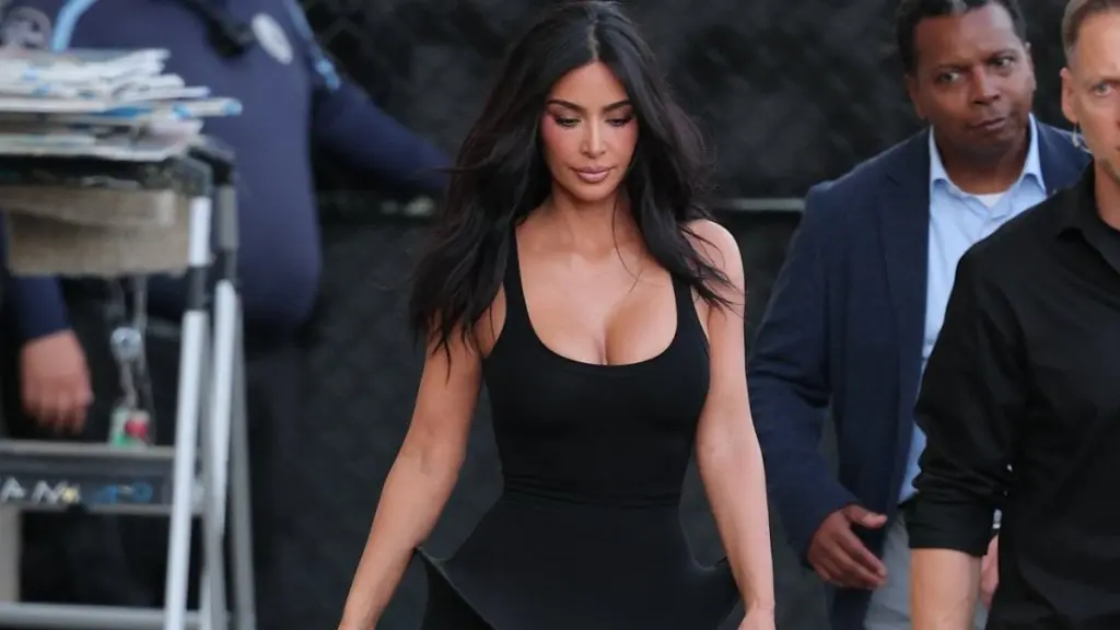 Kim Kardashian Stuns in Black Peplum Gown on Late Night TV