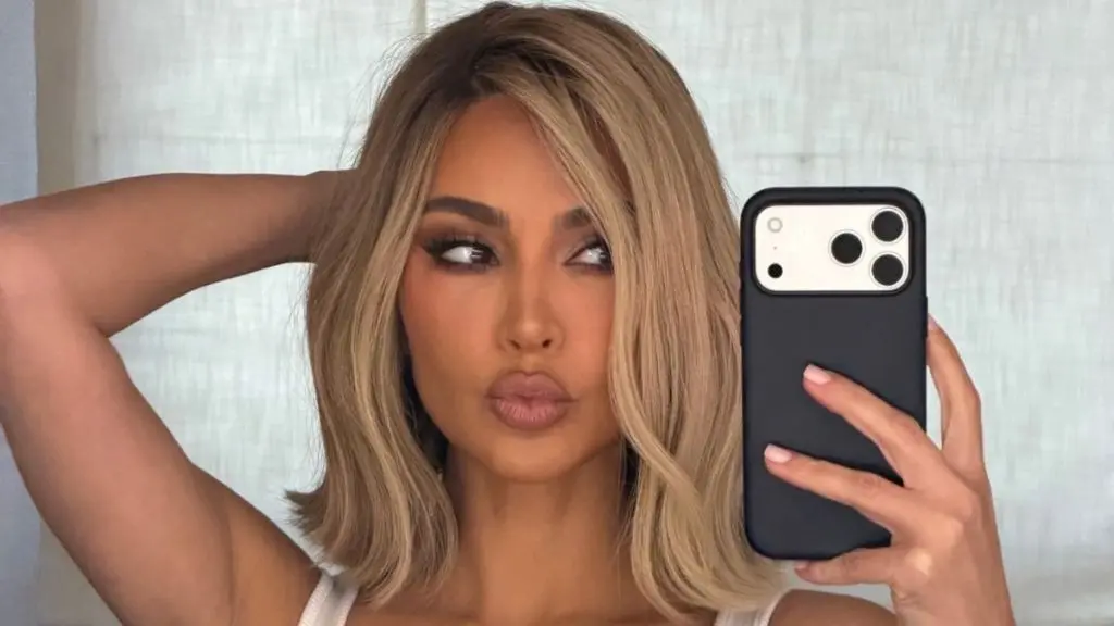 Kim Kardashian Turns Heads in Plunging Black Dress During Japan Trip